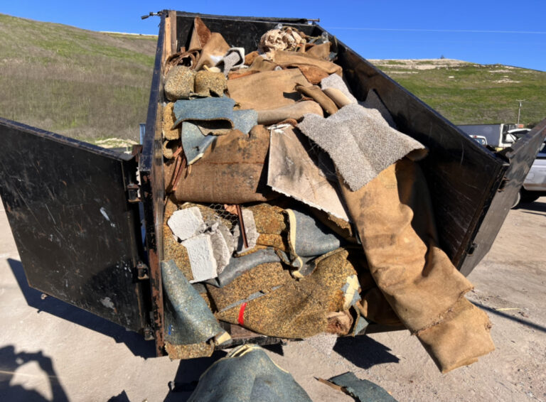 Dump Trailer Loaded with Carpet